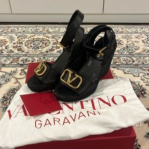 Preowned Valentino black leather wedge sandals.
